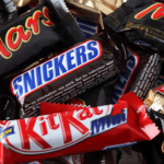Pile of various chocolate candy bars.