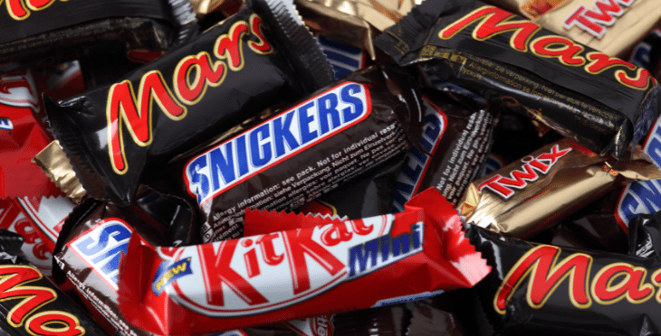 Pile of various chocolate candy bars.