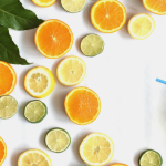 Slices of citrus fruits, including oranges and limes.