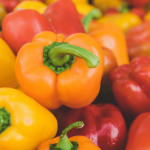 Colorful bell peppers, including red, yellow, and orange.