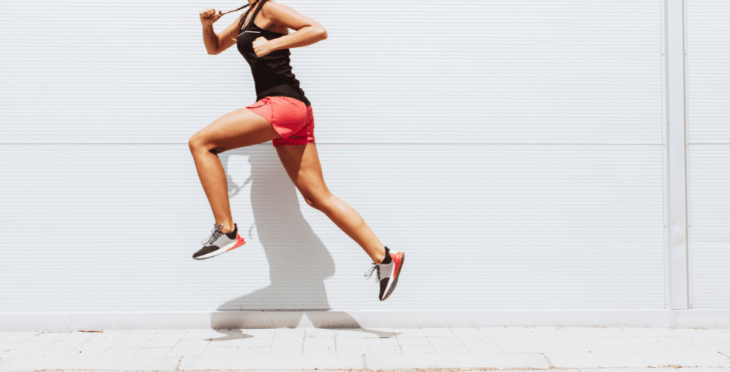 Woman running in athletic wear.