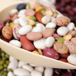 Bowl of mixed beans on a table.