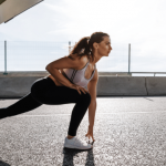 Woman stretching outside before a workout.