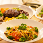 Colorful vegetable dish in a restaurant setting.