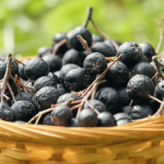 Basket filled with black olives.